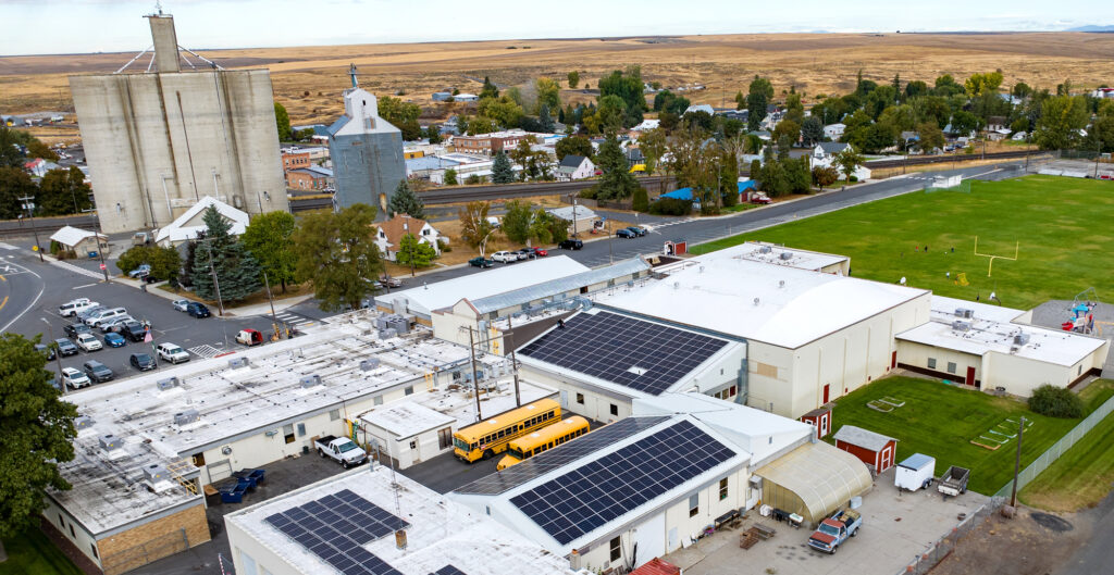 An aerial view of the Harrington School District and solar panels that were recently installed as part of The Giving Grid.