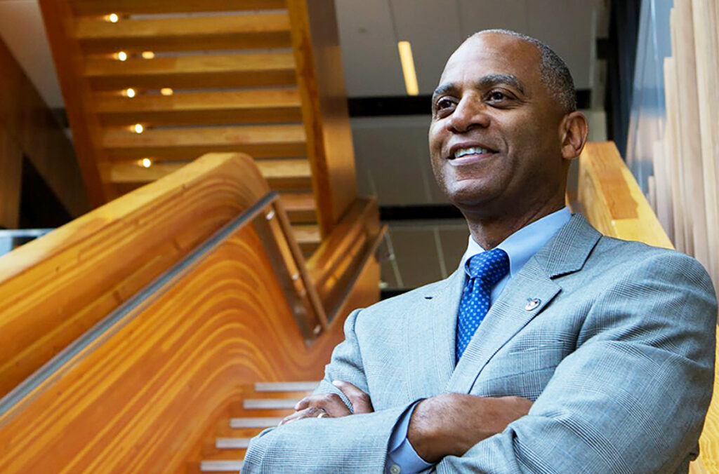 Closeup of Paul Pitre in front of a staircase.
