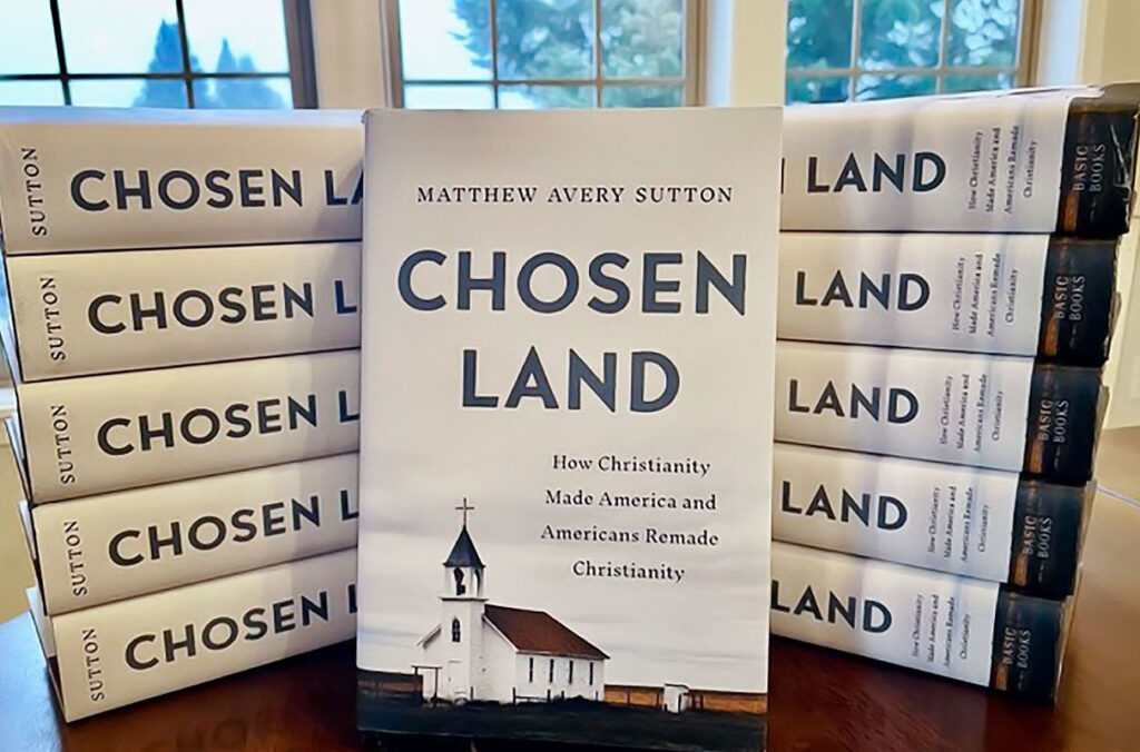 A closeup of a pile of the book 'Chosen Land' by WSU's Matthew Avery Sutton.