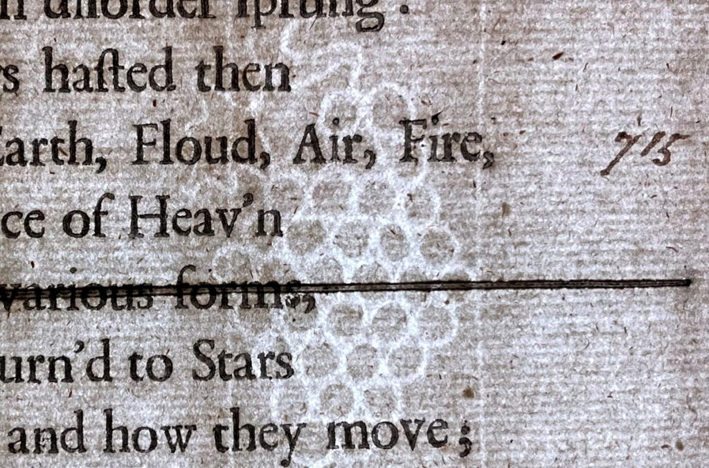 A watermark of a bunch of grapes is faintly visible on a page from the 1688 edition of Milton’s "Paradise Lost."