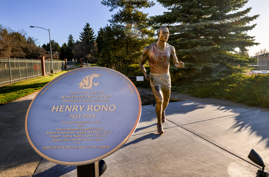 Closeup of a bronze statue of former WSU track and field athlete Henry Rono.