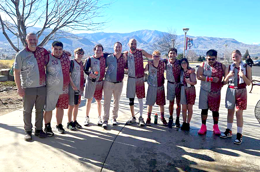 The Whitman County Superstars basketball team posing with coaches.