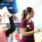 Three medical staff at work superimposed over a collage of health-related images like x-rays and charts.