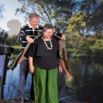 Joe Gladstone presents a gift to Michelle Evans in Melbourne, Australia.