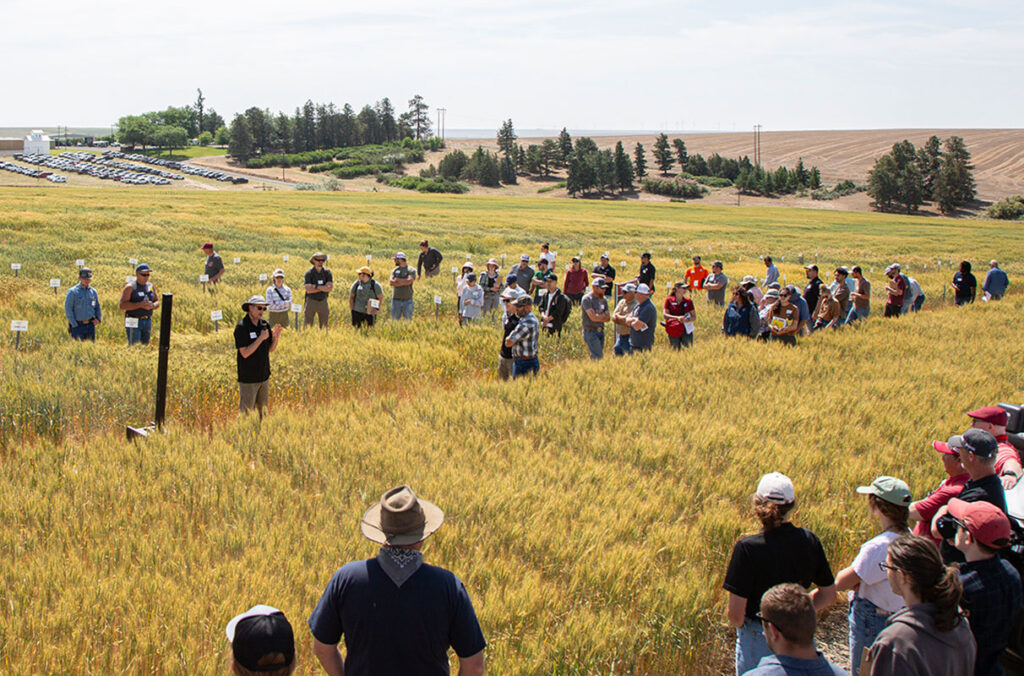 A crowd of people gather at the Lind Dryland Station.
