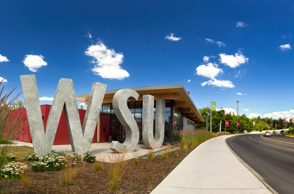 Exterior view of the Brelsford WSU Visitor Center on a sunny day.