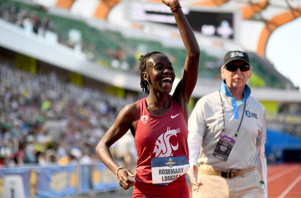 WSU track athlete Rosemary Longisa raising an arm in celebration after winning the 1500m championship.