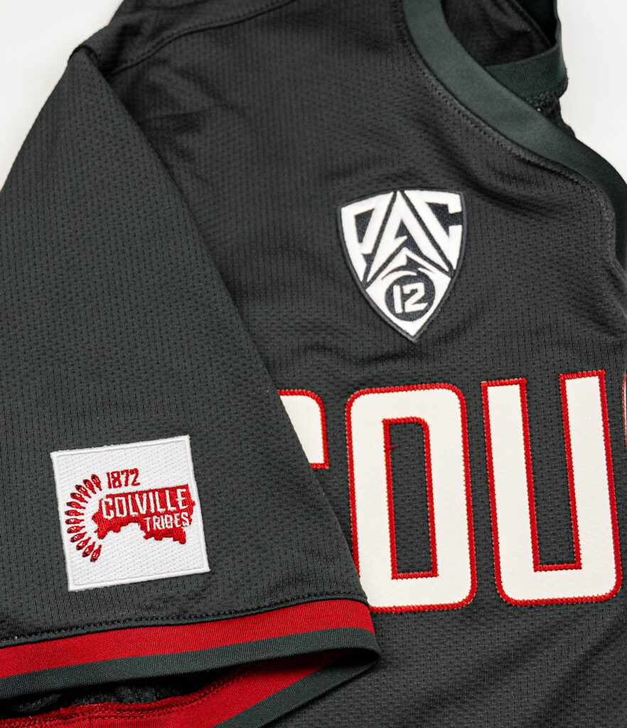 A Colville Tribe jersey patch on a gray WSU uniform.