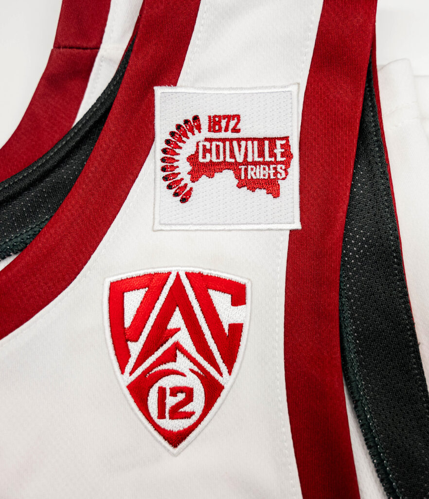 A Colville Tribe jersey patch on a white WSU uniform.