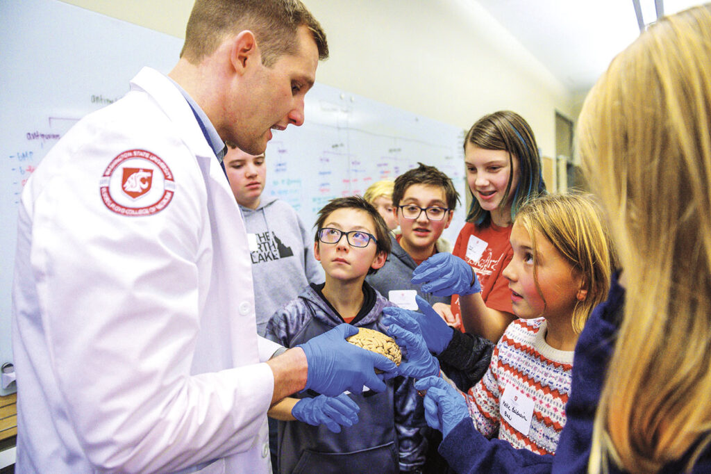 A doctor talks with Mead middle school students