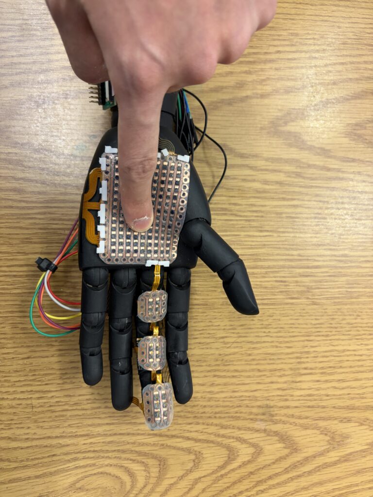 A robotic hand is fitted with 3D-printed sensor module.