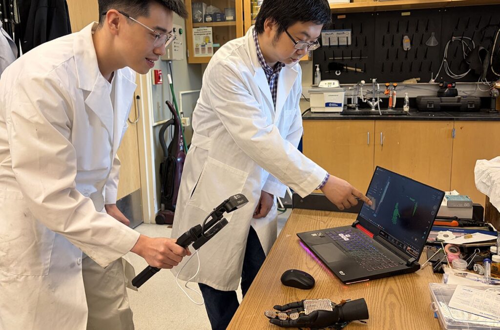 Professors test an electronic skin that can detect heat and pressure.