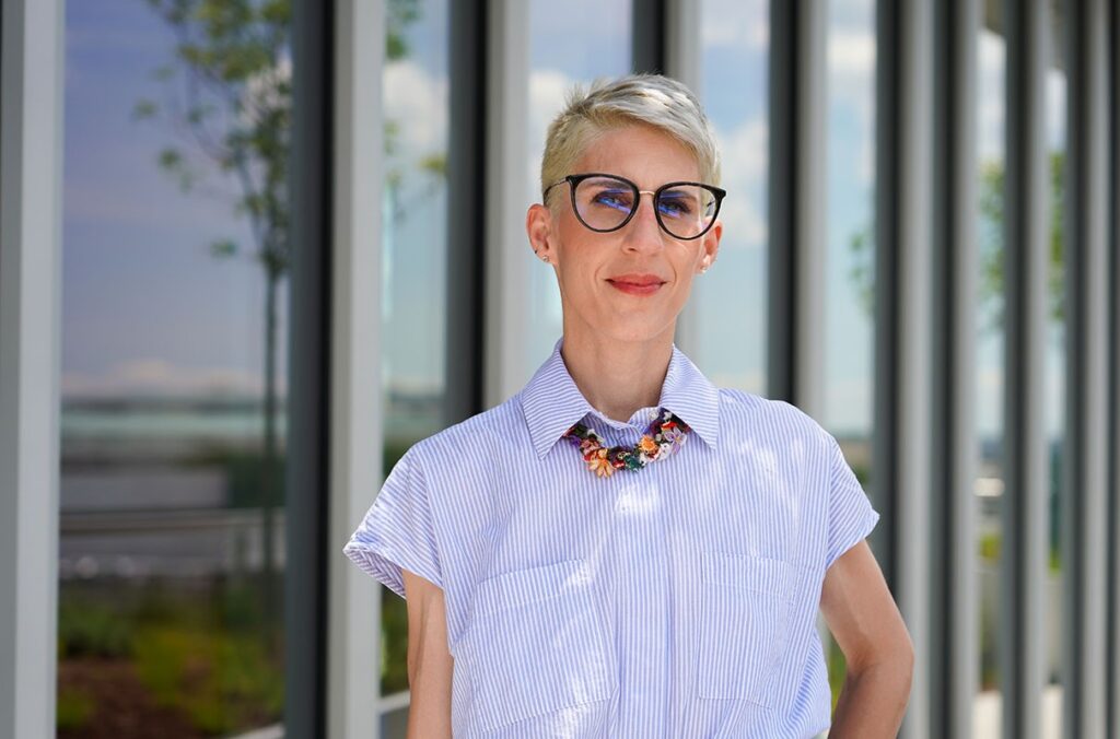 Professor Thessalia Merivaki poses outside an office building.