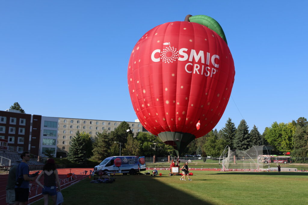 The Cosmic Crisp air balloon can be seen taking off from the WSU campus in Pullman.