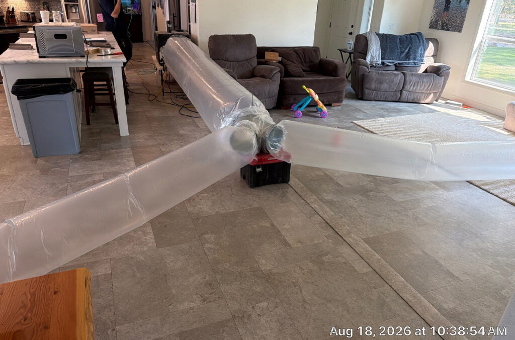 Plastic tubes filled with air can be seen in a living room.