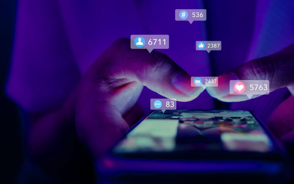 A user scrolls through social media on a phone