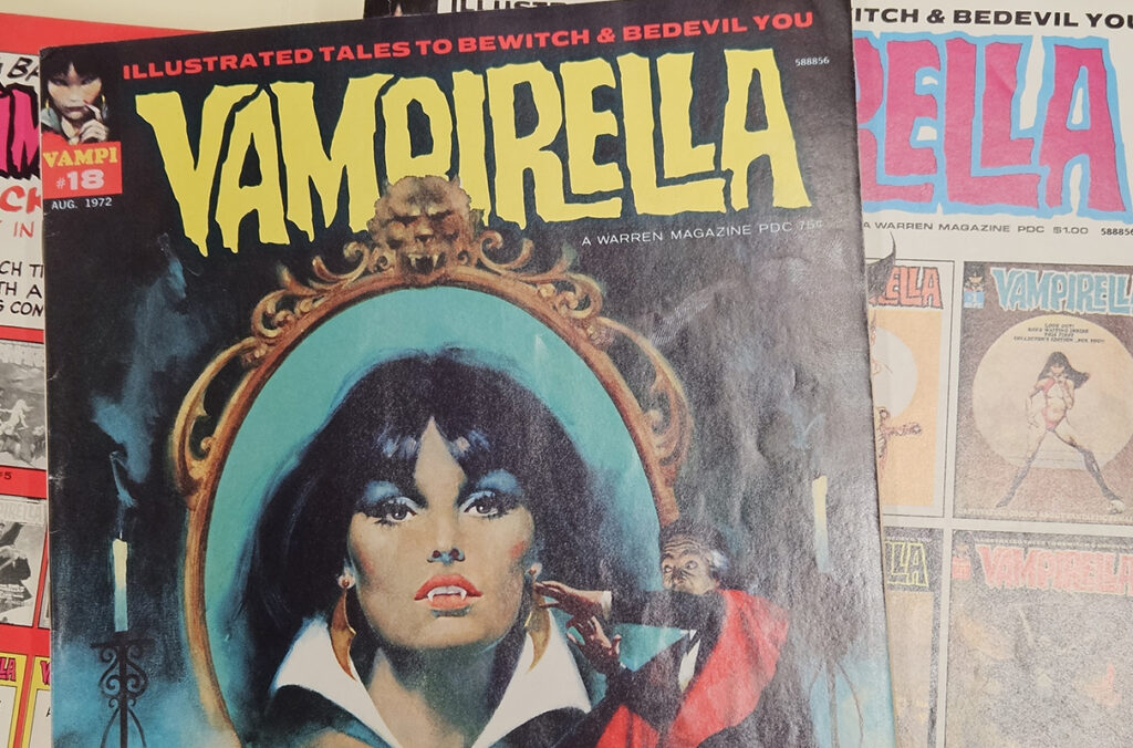 Three Vampirella comics can be seen laid out next to each other.