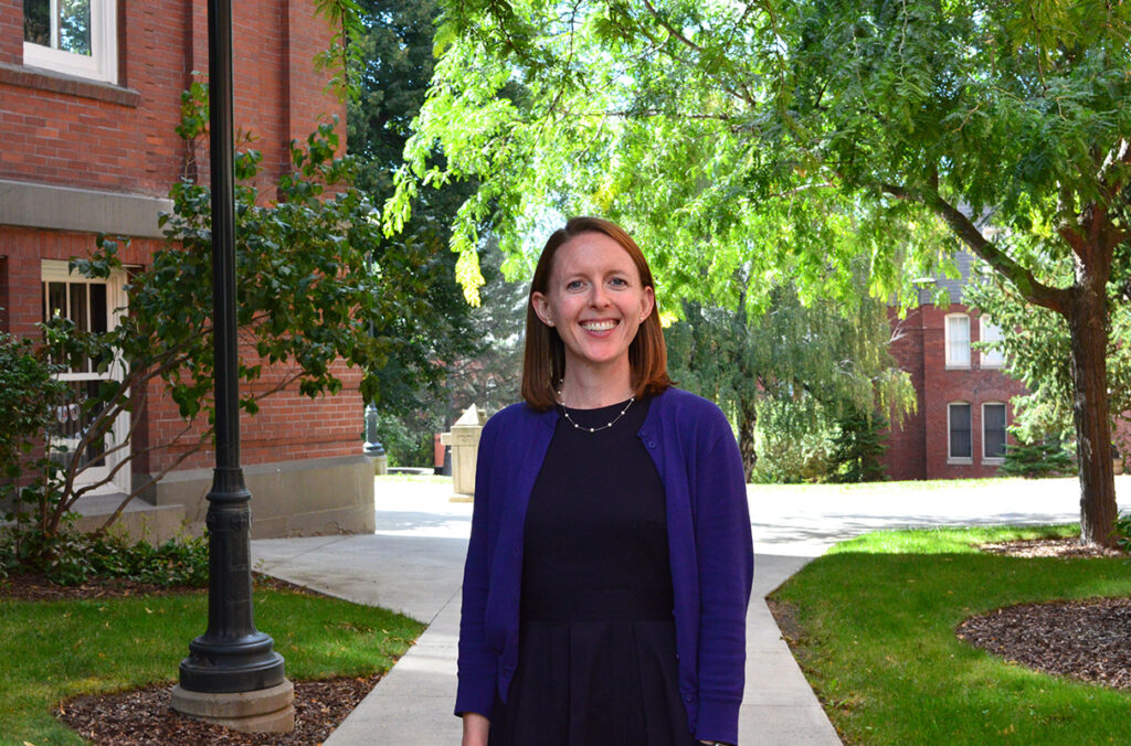 Portrait of Katie Forsythe standing on the Washington State University campus.
