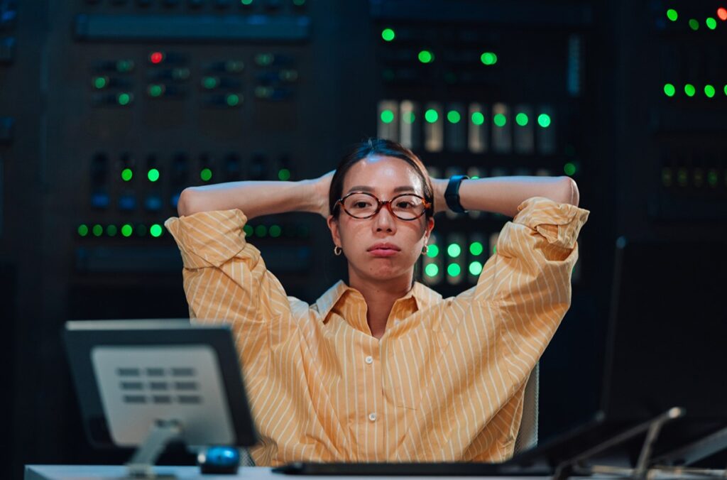 An illustration of a worker showing frustration at her desk.