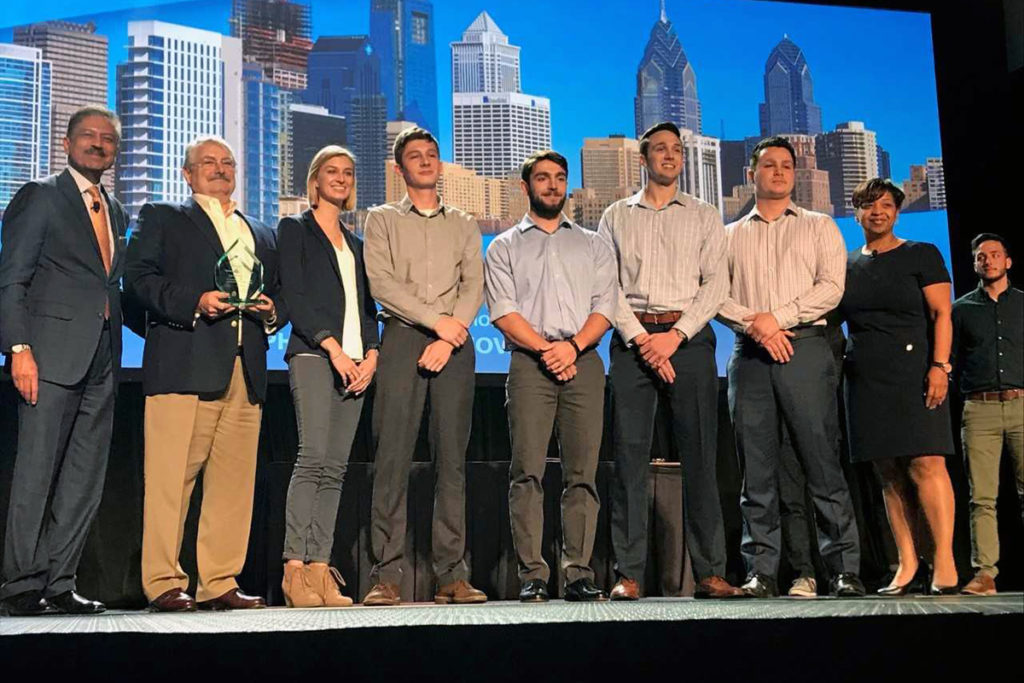WSU students accept winning award at 2017 Design Build Institute of America conference.