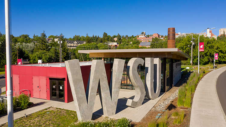 Aerial view of the giant concrete WSU statue outside Brelsford Visitor Center.