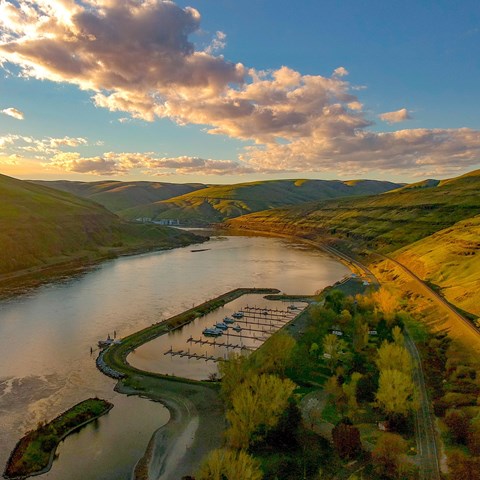 Aerial view of a campground next to a river.