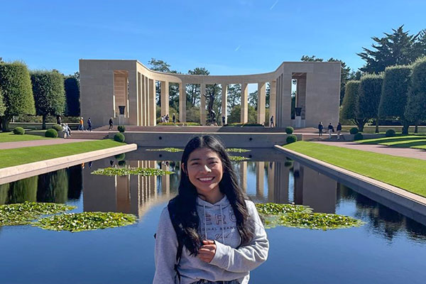 A woman visiting the Normandy American Cemetery and Memorial in Colleville-sur-Mer, Normandy, France.