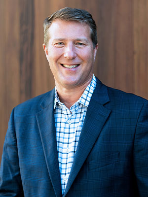 Headshot of Chad MacKay.