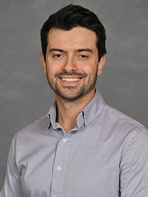 Headshot of Joan Qafoku.