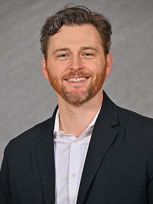 Headshot of Andrew Pirie.