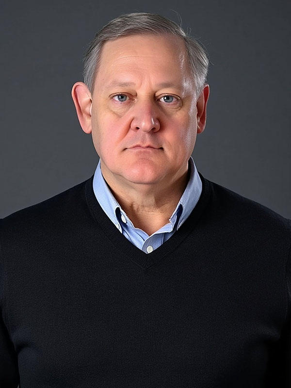 Headshot of Gregory Denton.