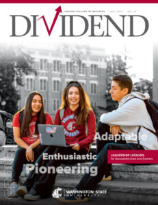 Cover of Dividend Magazine Fall 2023, Volume 37, featuring three students sitting on outdoor steps with a laptop, wearing WSU apparel. Words like “Dedicated,” “Adaptable,” “Enthusiastic,” and “Pioneering” appear across the image, along with a red banner reading “Leadership Lessons for Successful Lives and Careers.” Washington State University logo is at the bottom.