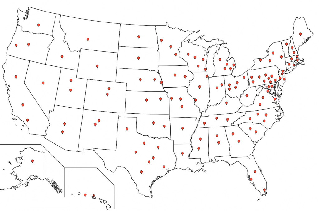 Map of the United States with red markers indicating PhD graduate placement locations across nearly every state.