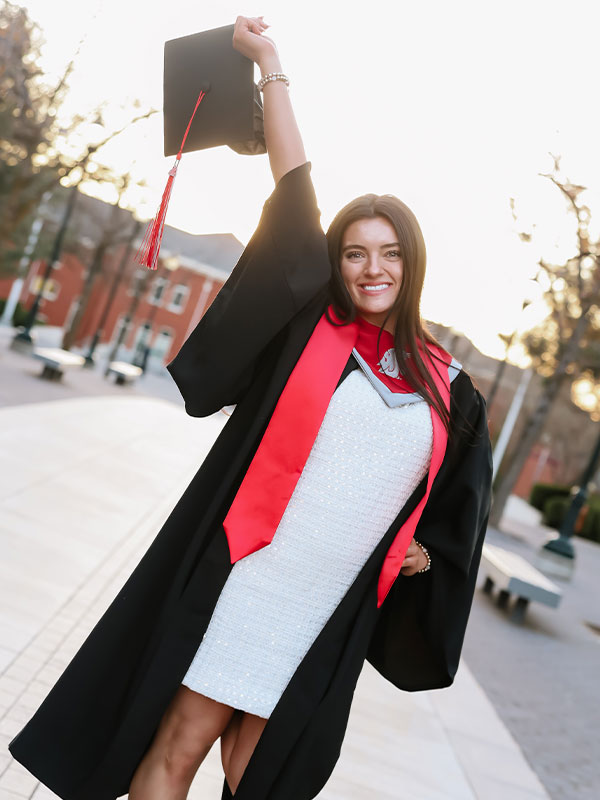 Hospitality Business Management graduate Hadley Franklin poses outside Todd Hall at Washington State University.
