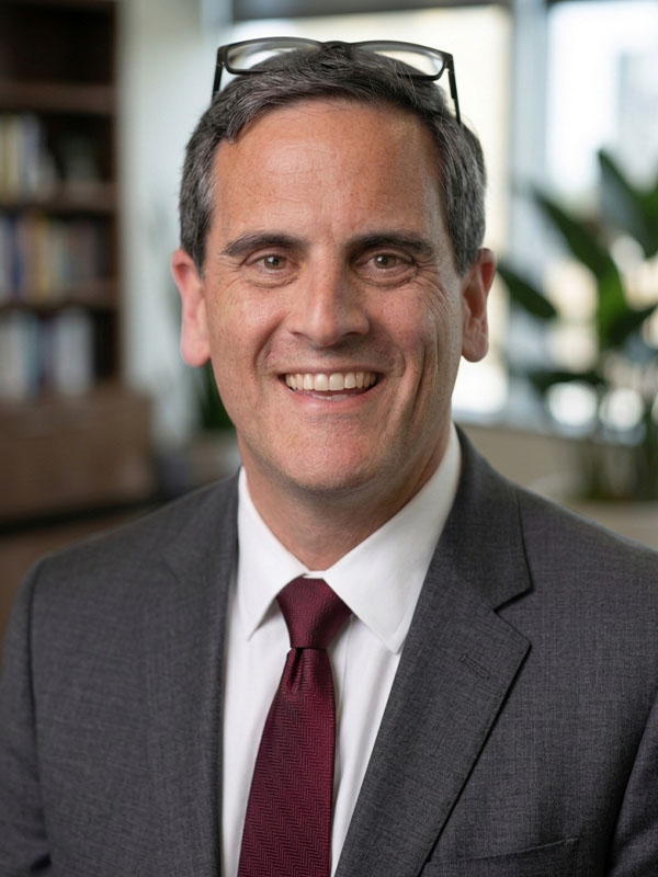 Headshot of Jim Caruso.