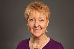 Headshot of Debi Mundell, M.ED., MBA Professor.