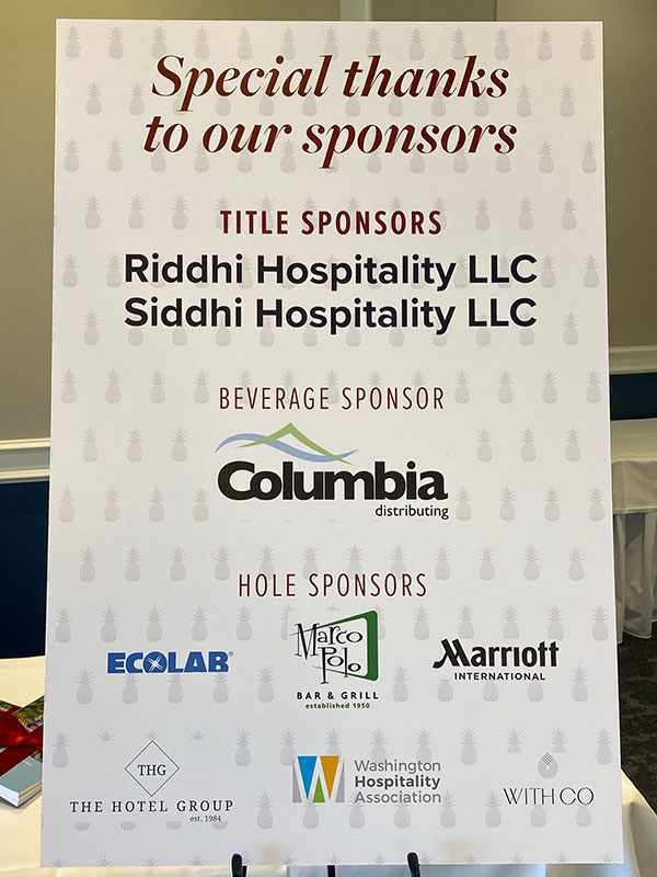 Poster displaying sponsor acknowledgments for the SHBM First Annual Golf Tournament, listing title sponsors Riddhi Hospitality LLC and Siddhi Hospitality LLC, beverage sponsor Columbia Distributing, and hole sponsors including Ecolab, Marco Polo Bar & Grill, Marriott International, The Hotel Group, Washington Hospitality Association, and WithCo.