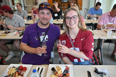 Guests seated at tables sampling sparkling beverages and food pairings during the sold-out Battle of the Bubbles event at Apple Cup.