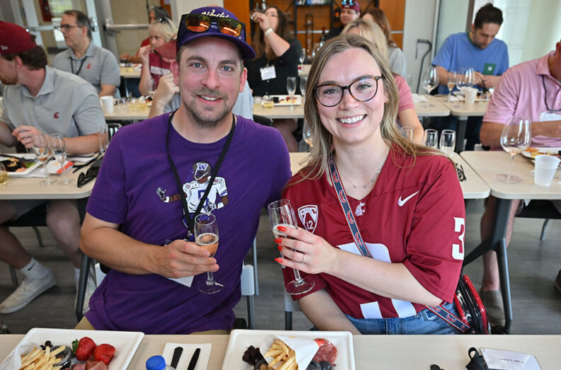 Guests seated at tables sampling sparkling beverages and food pairings during the sold-out Battle of the Bubbles event at Apple Cup.