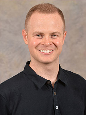 Headshot of Benjamin Warnick.