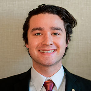 Headshot of Alex Stuart.