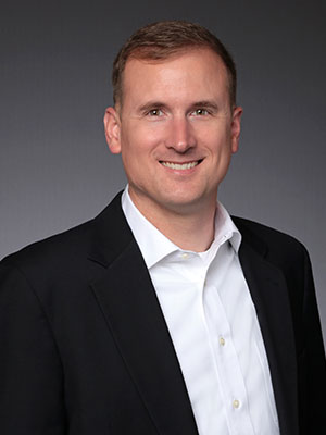 Headshot of Mike Holcomb.