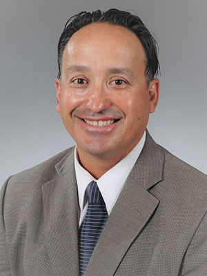 Headshot of Miguel Inzunza.