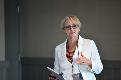 Laurie Nichols speaks while holding notes during a session on succession planning at the 2021 Executive MBA Leadership Conference.