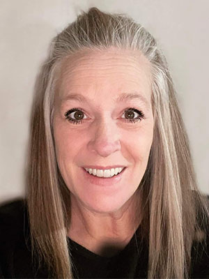 Headshot of Rayne Chandler.