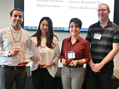 Group photo of participants holding awards at the WSU Graduate and Professional Student Association Research Exposition and Academic Showcase.