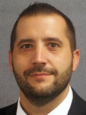 Headshot of John Skadorwa.