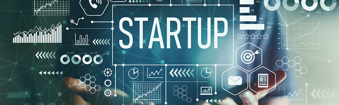 Digital graphic featuring the word ‘STARTUP’ surrounded by icons and charts representing business growth, data, and innovation.