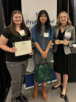 Zoie Rodman, a third attendee, and Kiersten Brightbill stand together as Rodman and Brightbill display their OSCPA honors.