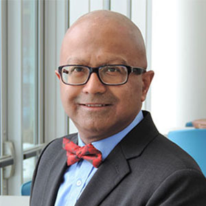 Headshot of Dipra Jha.